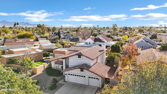 birds eye view of property with a mountain view