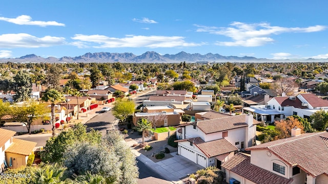 birds eye view of property featuring a mountain view