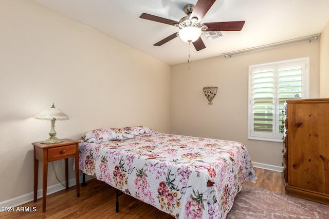 bedroom featuring ceiling fan and wood-type flooring