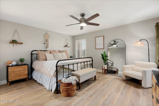 bedroom featuring light wood-type flooring and ceiling fan