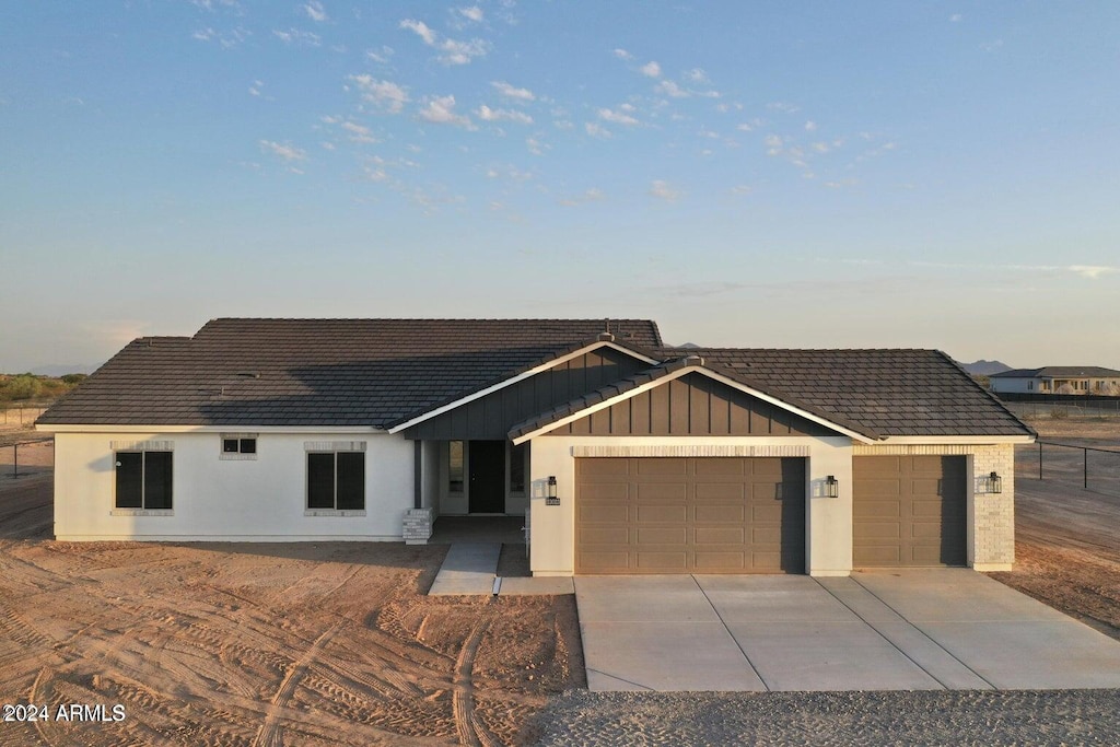 single story home featuring a garage