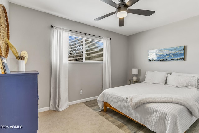 bedroom with ceiling fan and hardwood / wood-style floors