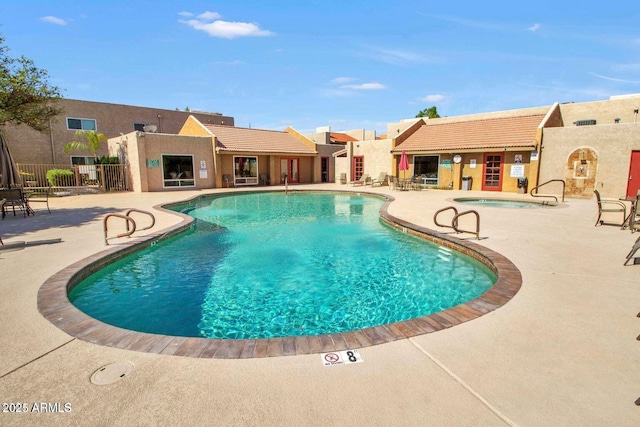 view of pool featuring a patio