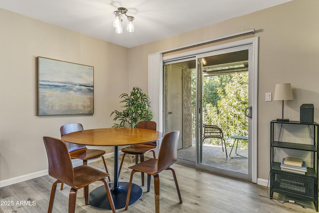 dining area with light hardwood / wood-style flooring