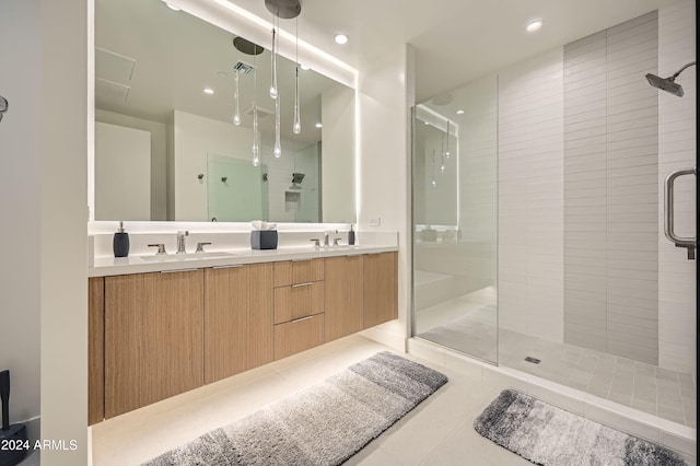 bathroom featuring tile patterned floors, vanity, and walk in shower