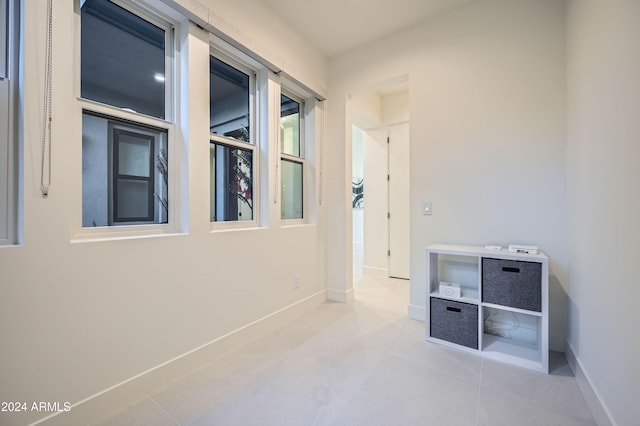 hallway with light tile patterned flooring