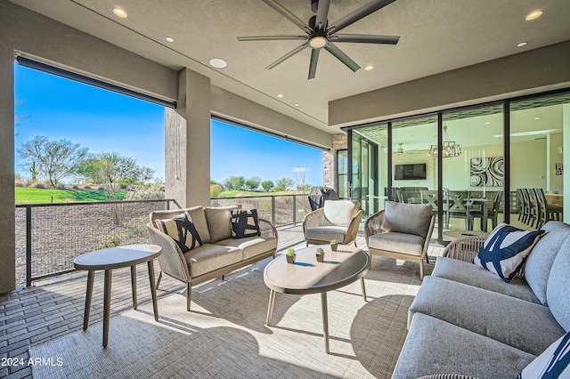 sunroom featuring ceiling fan