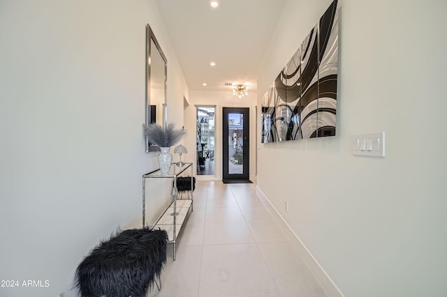 hall with light tile patterned flooring