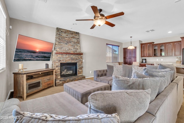 742 E Kingbird Dr, Gilbert, AZ 85297 - living area featuring a ceiling fan, a fireplace, light carpet, and recessed lighting