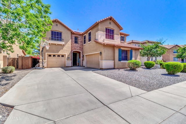 742 E Kingbird Dr, Gilbert, AZ 85297 - mediterranean / spanish home featuring stucco siding, a garage, roof mounted solar panels, and driveway