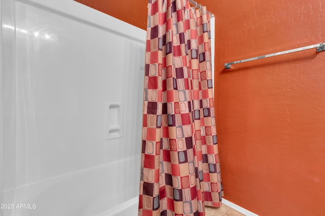 742 E Kingbird Dr, Gilbert, AZ 85297 - bathroom with a textured wall, shower / bathtub combination with curtain, and tile patterned floors