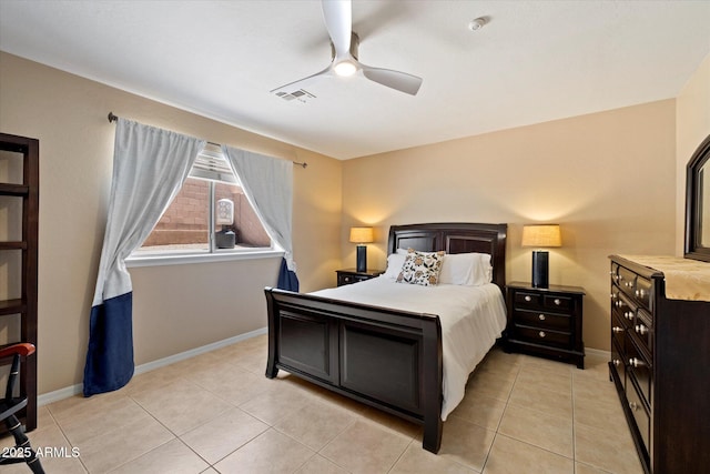 bedroom featuring visible vents, baseboards, ceiling fan, and light tile patterned floors