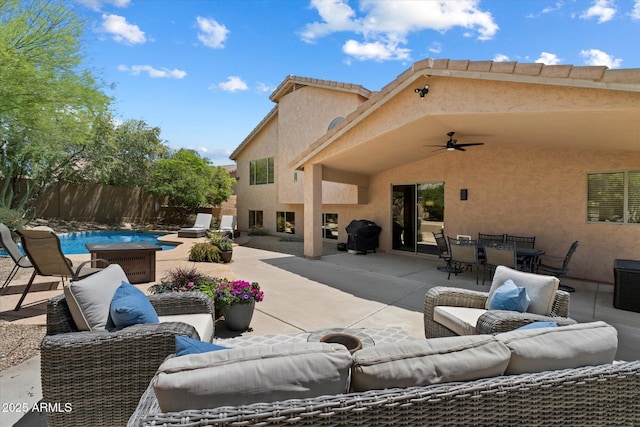 view of patio with fence, an outdoor living space, a ceiling fan, a fenced in pool, and outdoor dining space