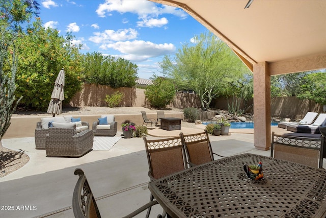 view of patio / terrace with a fenced backyard, outdoor lounge area, and outdoor dining space