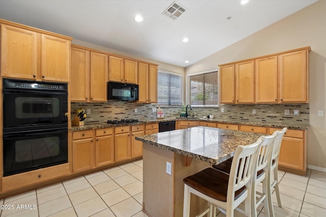 kitchen featuring backsplash, visible vents, vaulted ceiling, light tile patterned floors, and black appliances