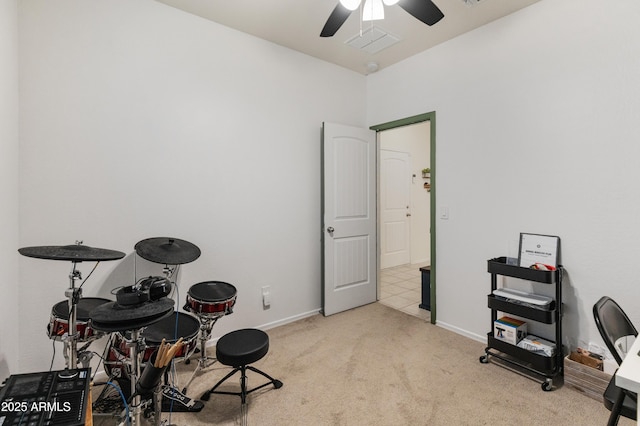 miscellaneous room featuring baseboards, carpet, visible vents, and ceiling fan