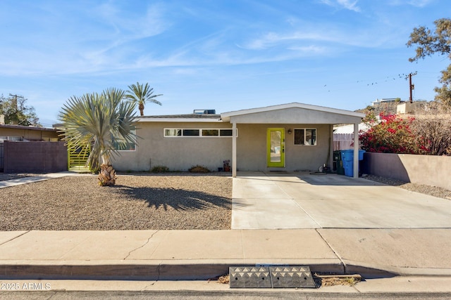 single story home with a carport