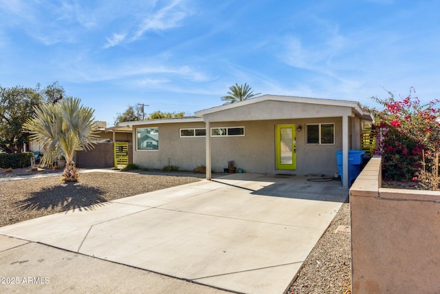 ranch-style home with a carport