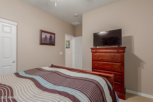 bedroom featuring visible vents, baseboards, carpet, and a ceiling fan