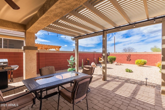 view of patio / terrace with a fenced backyard, outdoor dining space, and a pergola