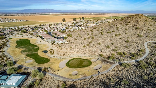 birds eye view of property with a mountain view