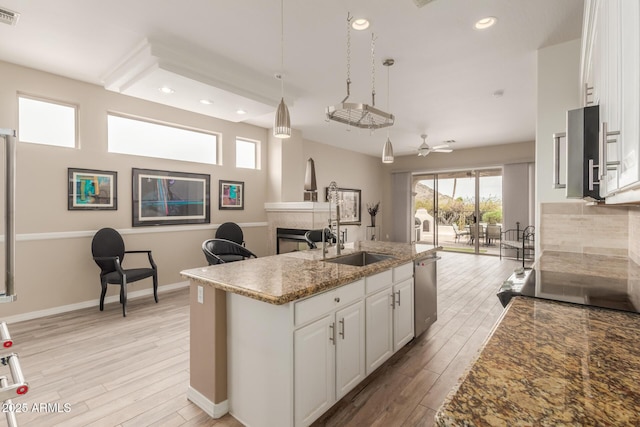 12841 N 19th St, Phoenix, AZ 85022 - kitchen with visible vents, white cabinets, a sink, and open floor plan