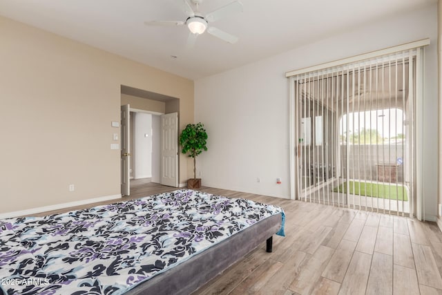 12841 N 19th St, Phoenix, AZ 85022 - bedroom featuring baseboards, a ceiling fan, wood finished floors, and access to outside