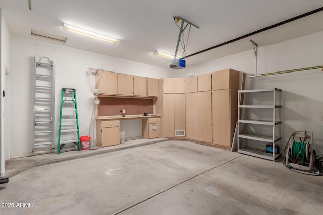 12841 N 19th St, Phoenix, AZ 85022 - garage featuring visible vents and a garage door opener