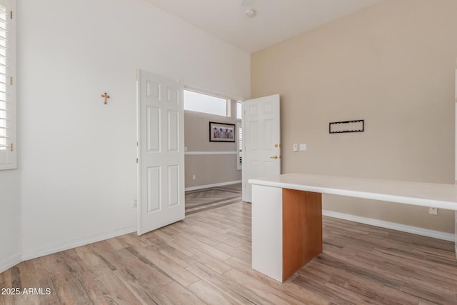 12841 N 19th St, Phoenix, AZ 85022 - interior space featuring light countertops, baseboards, and light wood-style floors