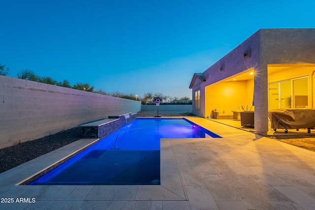 view of swimming pool with a patio area, a fenced backyard, and a fenced in pool