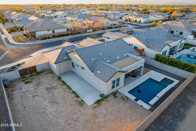 birds eye view of property with a residential view