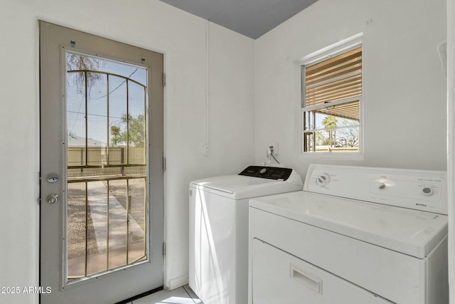 laundry room featuring independent washer and dryer and laundry area