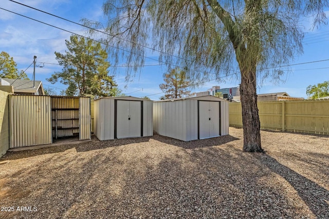 view of shed with a fenced backyard