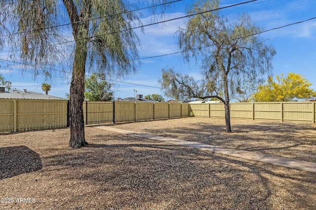 view of yard with a fenced backyard