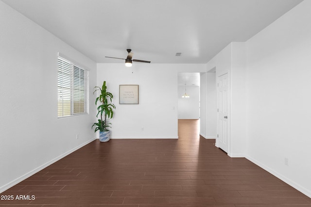 unfurnished room featuring dark hardwood / wood-style floors and ceiling fan