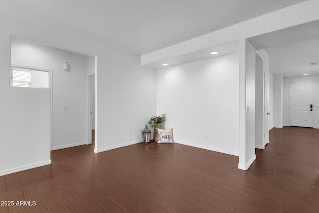 unfurnished room featuring dark wood-type flooring