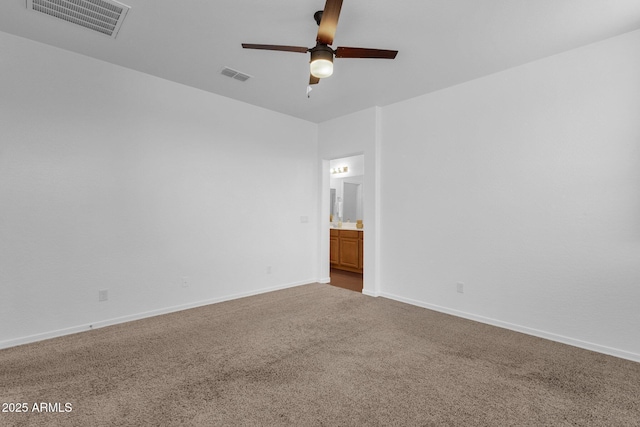 carpeted empty room featuring ceiling fan