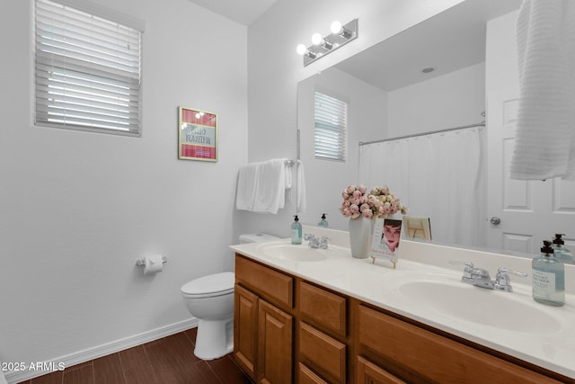 bathroom with a shower with curtain, vanity, and toilet