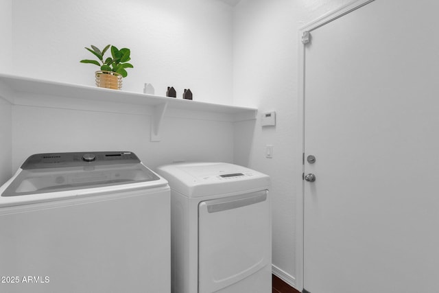 laundry room featuring washing machine and dryer