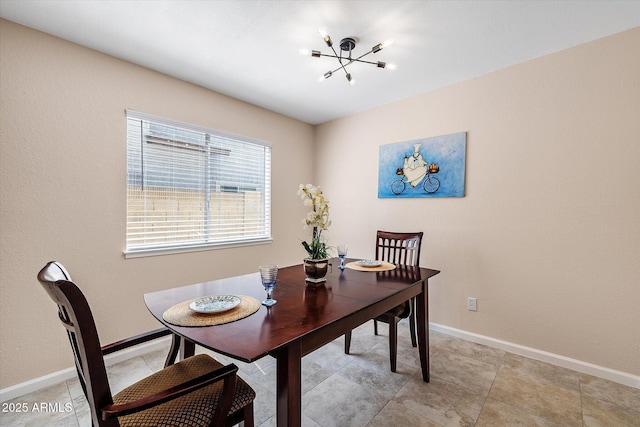 3021 E Harmony Cir, Mesa, AZ 85204 - dining space featuring a chandelier and baseboards