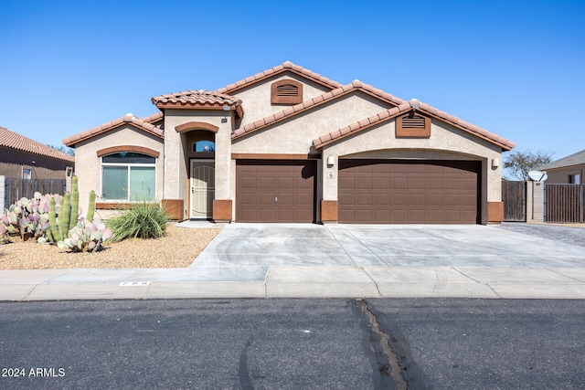 mediterranean / spanish-style home featuring a garage