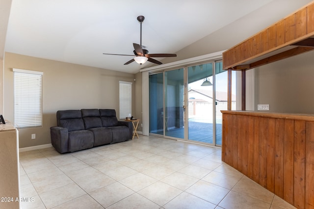 tiled living room with vaulted ceiling and ceiling fan