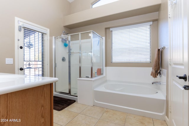 bathroom with shower with separate bathtub, plenty of natural light, and tile patterned flooring