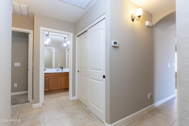 hallway with light tile patterned floors