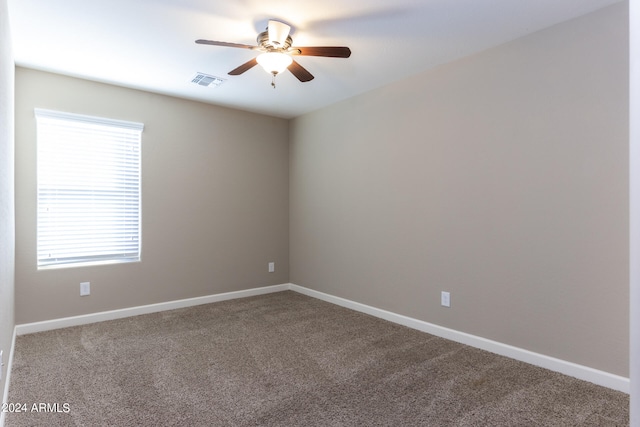 unfurnished room with carpet floors and ceiling fan