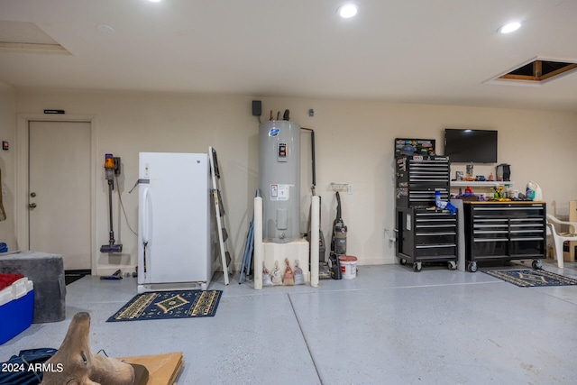 garage featuring white fridge and electric water heater