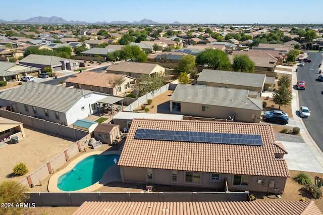 birds eye view of property with a mountain view