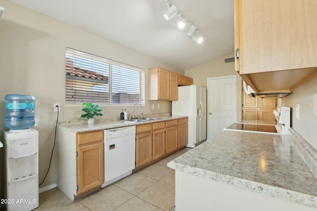 kitchen with sink, light brown cabinets, vaulted ceiling, white appliances, and light tile patterned floors