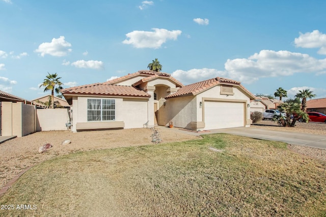 mediterranean / spanish-style home with a garage and a front lawn