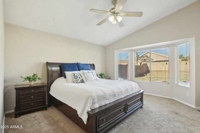 bedroom with ceiling fan, light carpet, and vaulted ceiling